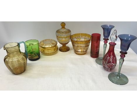 Coloured glassware inc engraved amber glass lidded urn, bowl and vase together with red glass vase and decanter, 1 green drin