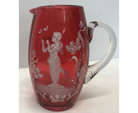 Mary Gregory ruby glass jug, approx 15cms h, gilt rubbed to the rim. 