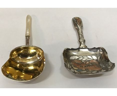 Two Georgian silver tea caddy spoons, one with gilding to the bowl and mother of pearl handle hallmarked Birmingham 1810, Sam