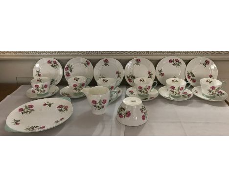 Shelley rosebud tea service to include 6 plates, 6 saucers, 6 cups, 1 sugar basin, 1 milk jug (chip to base) and 1 cake plate