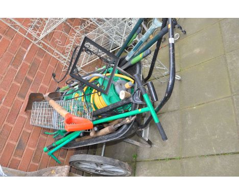 A LARGE WHEELED GARDENING WHEEL BARROW, and a quantity of garden tools and hose reels