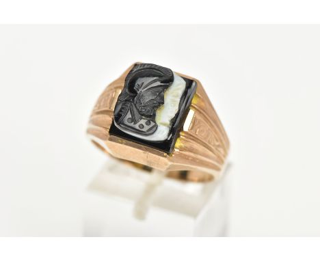 A GENTS 9CT GOLD CAMEO SIGNET RING, of a square form, set with a black and a white carved Roman figure in profile, textured s