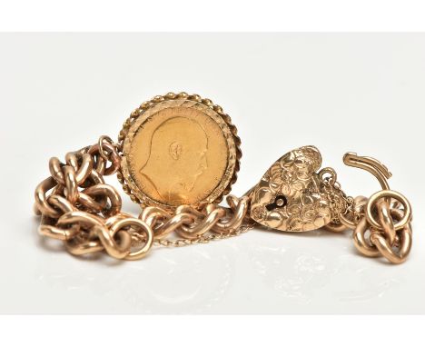 A 9CT GOLD CHARM BRACELET WITH A MOUNTED FULL SOVEREIGN COIN, curb link bracelet alternating links stamped 9.375, fitted with