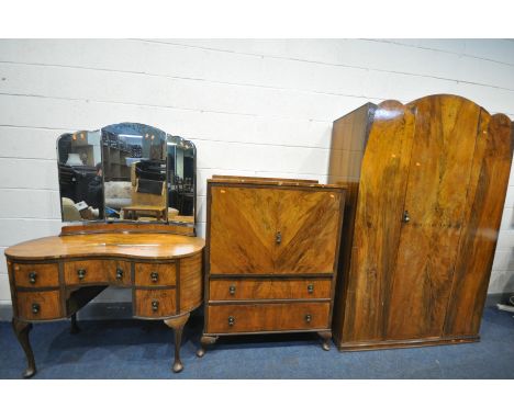 AN EARLY TO MID 20TH CENTURY WALNUT BEDROOM SUITE comprising of a kidney shaped dressing table, with a triple mirror, width 1