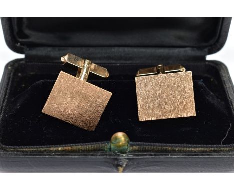 A PAIR OF 9CT GOLD CUFFLINKS, each of a rectangular form with a textured bark effect, approximate dimensions length 19.1mm wi