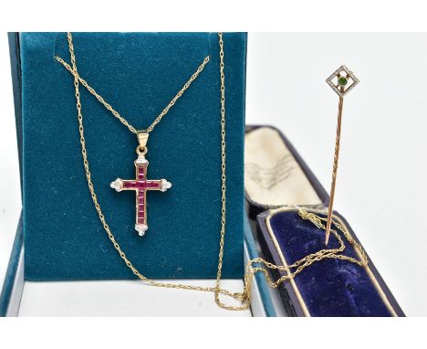 A 9CT GOLD RUBY AND DIAMOND CROSS PENDANT NECKLACE AND A YELLOW METAL STICK PIN, the cross pendant set with square cut rubies