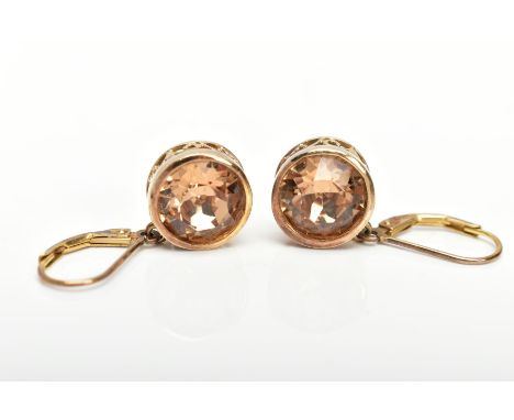 A PAIR OF SILVER GILT DROP EARRINGS, each set with a circular cut foil coated quartz, bezel set within an openwork scroll mou