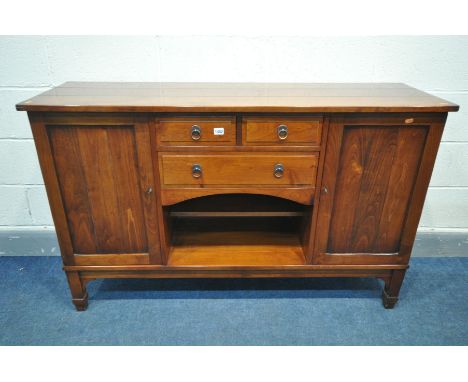 A CHARLES BARR CHERRYWOOD SIDEBOARD, with double cupboard door flanking and arrangement of drawers and open shelf, width 140c