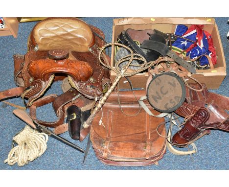 A SECOND HALF 20TH CENTURY LEATHER WESTERN SADDLE AND A BOX OF ACESSORIES, the saddle with decorative embossed sections and d