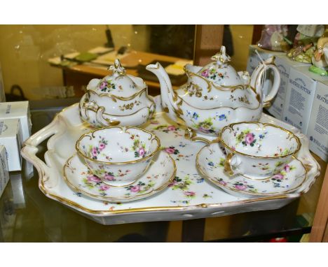 A LATE 19TH CENTURY CONTINENTAL PORCELAIN TETE-A-TETE SET, hand painted with floral sprays, comprising a teapot and cover, tw