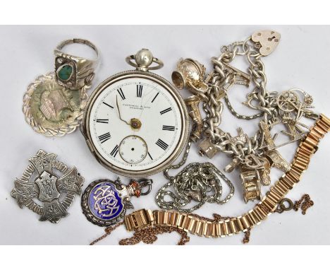 A BAG OF ASSORTED ITEMS, to include a white metal charm bracelet fitted with fourteen charms in forms such as the London brid