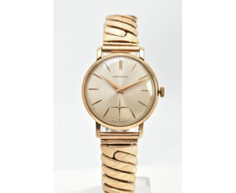 A GENTS 9CT GOLD 'GARRARD' WRISTWATCH, hand wound movement, round champagne dial signed 'Garrard', Baton markers, gold tone h