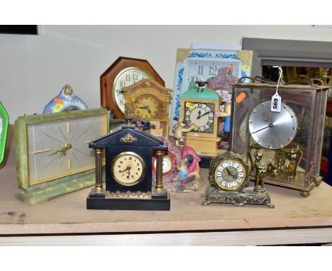 TWELVE ASSORTED MANTEL AND WALL CLOCKS, mostly quartz movement with resin cases, includes an onyx cased 'Cantador Electric' m
