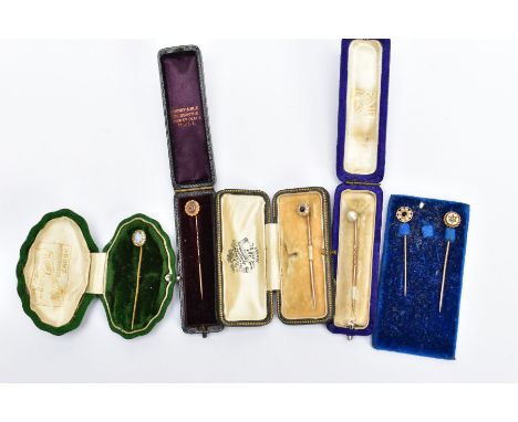 SIX YELLOW METAL STICK PINS, to include a circular cut sapphire with a halo of old cut diamonds prong set in yellow metal, un