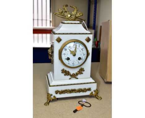 A LATE 19TH CENTURY WHITE MARBLE AND GILT METAL MANTEL CLOCK, the rectangular case with gilt finial of a bow, quiver, laurel 