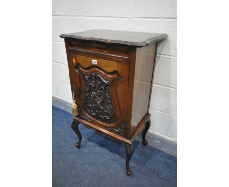 MAPLE AND CO OF LONDON AND PARIS, A EDWARDIAN MAHOGANY SINGLE DOOR CUPBOARD, with a foliate decorated panel, on cabriole legs