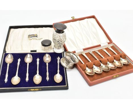 TWO CASED SETS OF SILVER TEASPOONS, A NAPKIN RING AND TWO VANITY JARS, to include a cased set of six silver apostle teaspoons