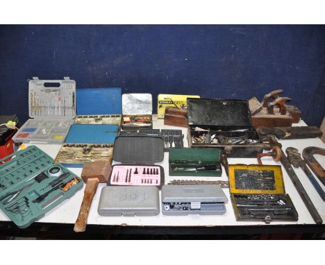 A SELECTION OF ENGINEERING TOOLS to include tap and die sets, wood planes, drill bits, screws, socket sets, a Record No24 Sti