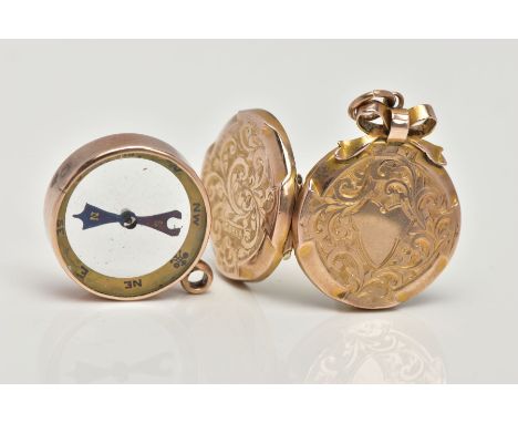 A YELLOW METAL COMPASS PENDANT AND LOCKET, a round locket, approximate width 21mm, detailed with scrolling foliage and a vaca