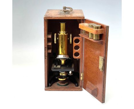 A J.Swift &amp; Son brass monocular microscope, circa 1900, with black lacquered base, numbered FH13032, in a mahogany case, 
