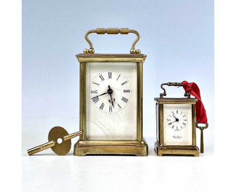 A miniature Swiss brass carriage timepiece, 20th century, by M Norman, height 6.5cm, together with a French carriage timepiec