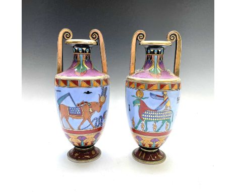 A pair of Continental porcelain Art Deco vases, probably French, each of Classical twin handled form, painted and gilt in the