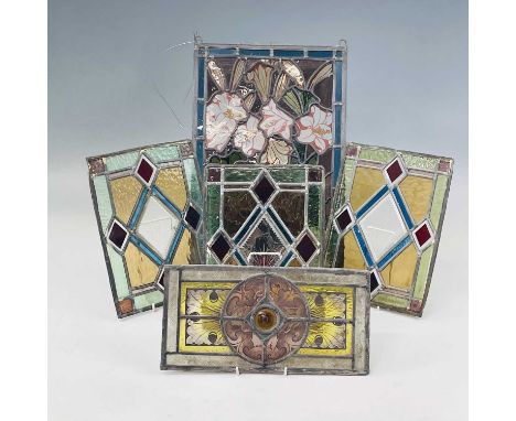 A Victorian stained glass panel, with painted floral design, 43 X 27.5cm, together with four similar smaller panels (three pe
