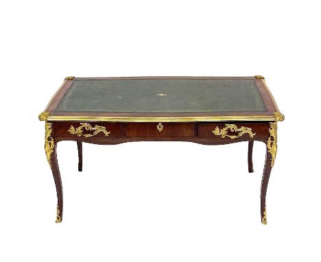 A French late19th century kingwood and ormolu mounted bureau plat, fitted with three frieze drawers, on cabriole legs, the ce