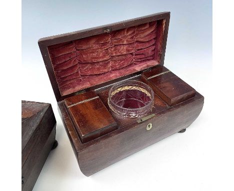 A late George III mahogany tea caddy, of slightly swollen sarcophagus form, internally with two lidded compartments and glass