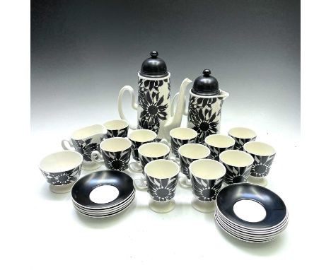 A Carlton ware black sunflower pottery tea and coffee service comprising, coffee pot and cover, hot water jug and cover, milk