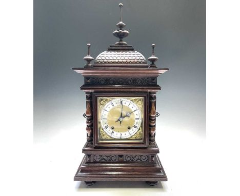 A German Winterhalder and Hofmeier oak architectural bracket clock, with turned finials and matt brass face, the movement str