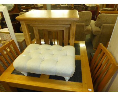 NEST OF THREE LIGHT BEECH OBLONG COFFEE TABLE ON REEDED STRAIGHT LEGS AND A BUTTON UPHOLSTERED FOOTSTOOL 