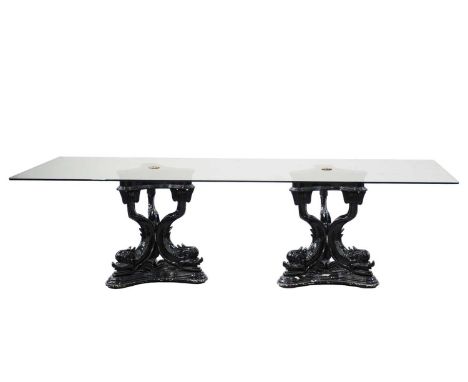 A large rectangular 'Hollywood Regency' vintage plate glass dining table, supported by a pair of pedestals formed by six styl