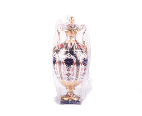 A Royal Crown Derby "Old Imari" bone china globular two-handled urn and cover, bearing the date mark for 2005, in its origina