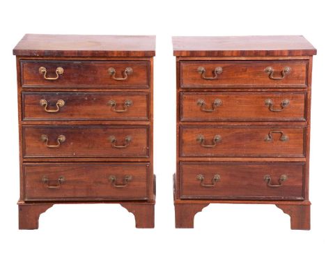 A pair of George III style mahogany pedestal chests of drawers, 19th century and later adaptations, each chest with four long