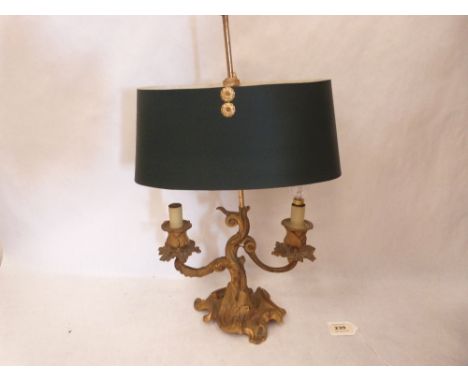 A rococo revival ormolu two light table lamp (Formerly a three light candelabrum)