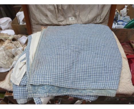 Three vintage quilts and other textiles in a vintage case