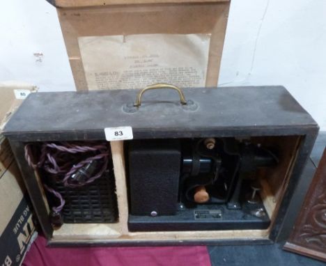 A vintage movie projector in case. The Alpha Filmstrip Lantern