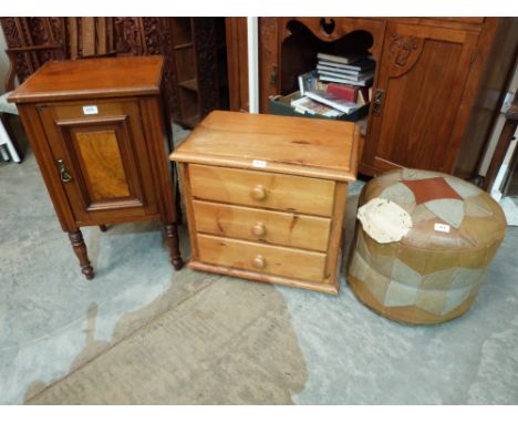 A pine three drawer bedside chest, a walnut pot cupboard and a leather pouffe