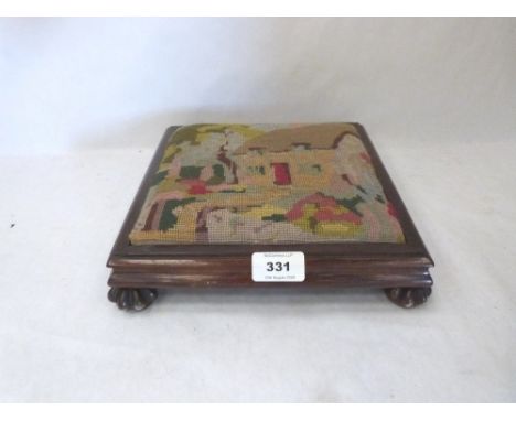 A Victorian rosewood footstool with tapestry top. 9½' wide