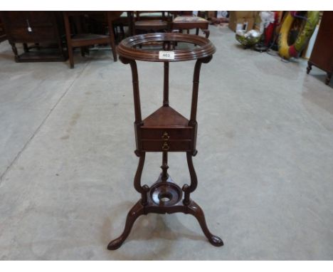 An 18th century mahogany basin stand, the centre stage with a drawer. 32' high
