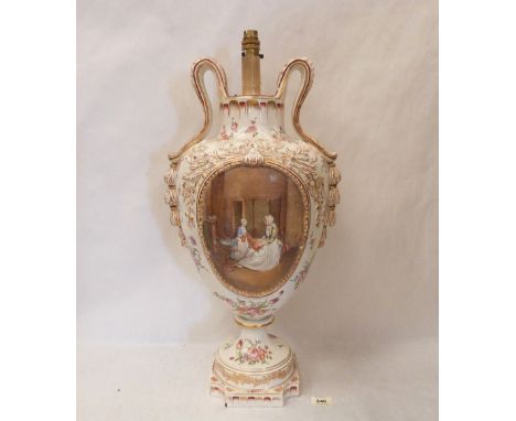 A continental two handled inverted baluster vase, converted to a table lamp, painted with a rserved interior scene and a land