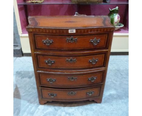 A 19th century serpentine inlaid satinwood commode chest with three drawers on bracket feet. 26½' wide