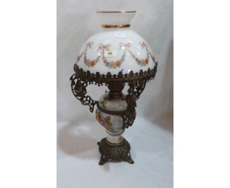 A ceramic and gilt metal table oillamp