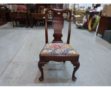 A Queen Anne side chair with shaped splat and drop-in tapestry seat, on scroll moulded cabriole legs. (One rear leg split)