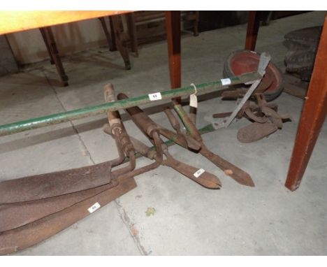 A garden plough and miscellaneous tools