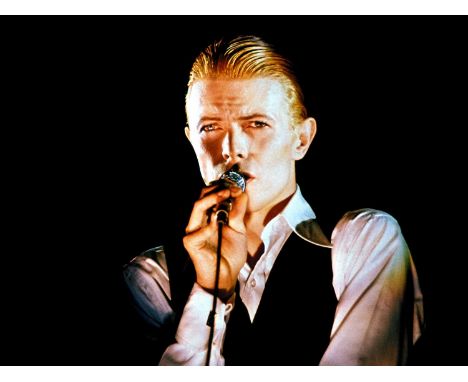 A high-quality photo print of a portrait of David Bowie, taken by photographer Philippe Auliac in 1976. Measures 30x 40cm. Wi