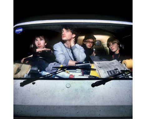 A high-quality photo print depicting U2, taken by photographer Martyn Goddard in 1980. The photo depicts the band in their to