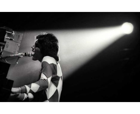 A high-quality photo print depicting Freddie Mercury, taken by photographer Martyn Goddard in 1977. The photo depicts Freddie