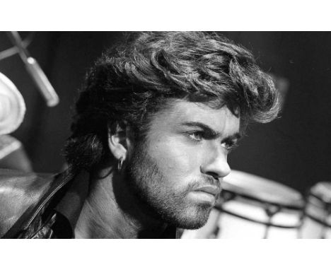 A high-quality photo print depicting George Michael, taken by photographer Martyn Goddard in 1986. The photo depicts George M